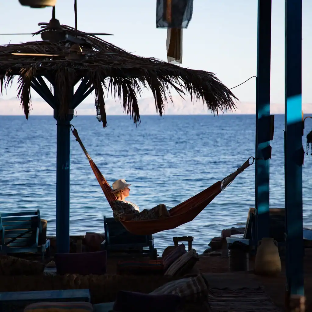 Dahab South Sinai | Red Sea Diving with Desert Cruise Travel 1 Woman enjoy the sound of the sea in Dahab